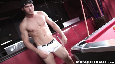 Muscular gay stud Chuck is playing pool and masturbating
