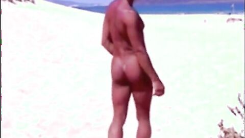 Tanned guy on beach in tiny string thong (temporarily!)