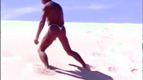 Tanned guy on beach in tiny string thong (temporarily!)