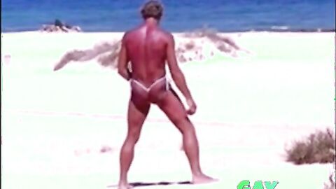 Tanned guy on beach in tiny string thong (temporarily!)