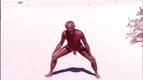 Tanned guy on beach in tiny string thong (temporarily!)