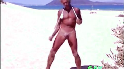 Tanned guy on beach in tiny string thong (temporarily!)