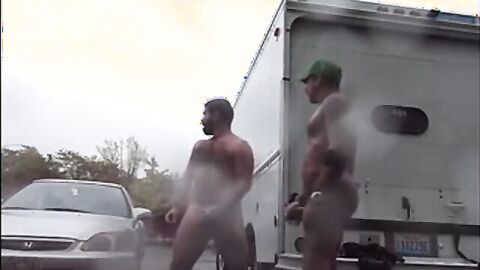 Public Rainy Stroking in a Parking Lot by Two Horny Men