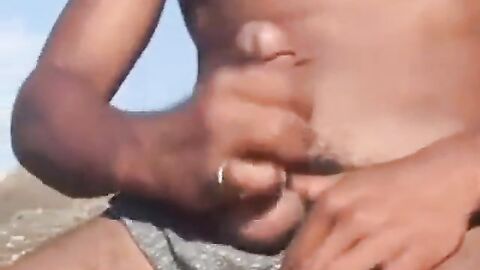 Arab Twink Strokes His Big Dick Outdoors by the Beach