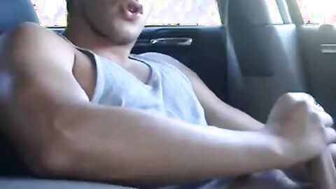 Big-cock jock strokes in his car