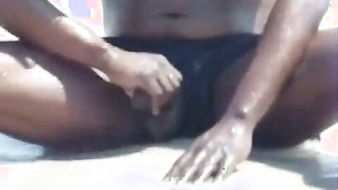 Black Amateur Strokes His Big Cock Outdoors at the Beach