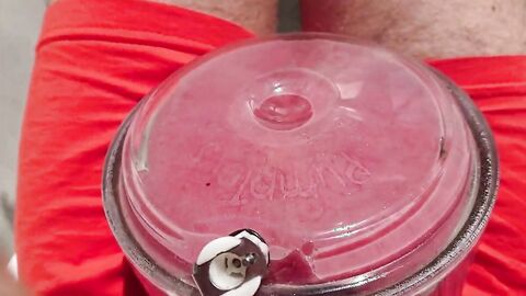 Giant balls pumping hunk outdoors