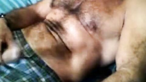 Bearded daddy strokes his cock solo