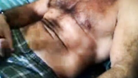 Bearded daddy strokes his cock solo