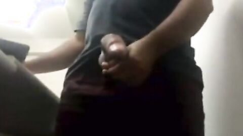 Brazilian Daddy Strokes His Big Uncut Cock at Work