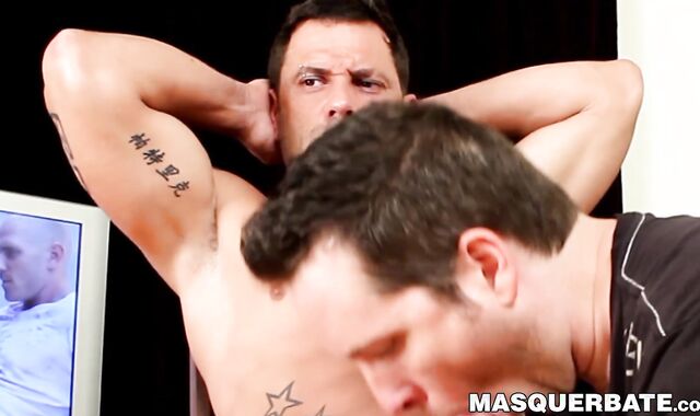 Buff stud vigorously masturbates after partner sucks him off