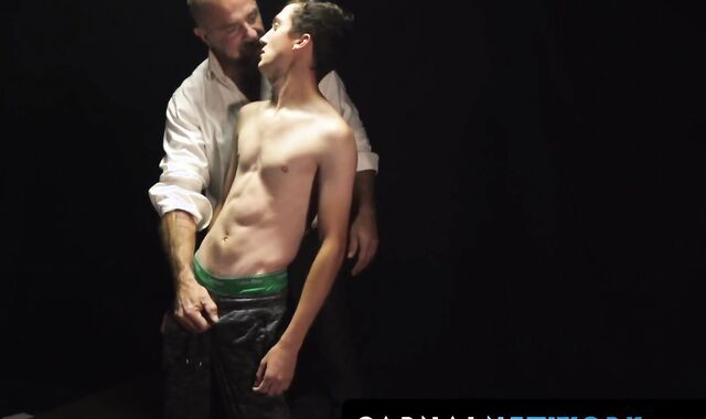 Felix Kamp presses the boy's moaning mouth into his bulging groin after fingering his