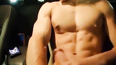 Big-Cocked Man Strokes in Car While Watching Porn