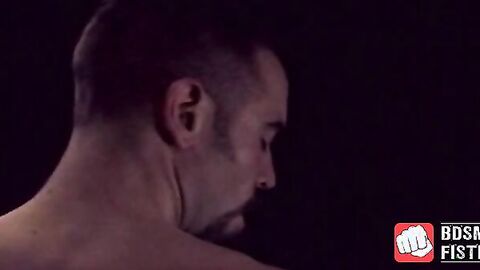 Muscular stud fist fucks himself and masturbates for cum