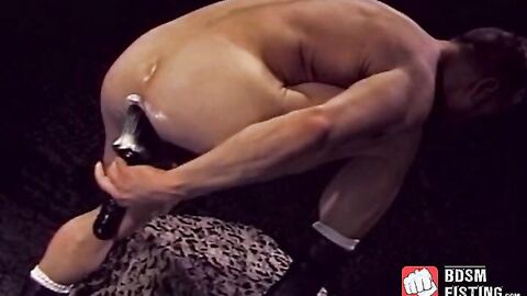 Muscular stud fist fucks himself and masturbates for cum