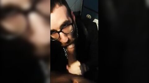 Bearded Guy Sucks Interracial Cock in a Public Restroom