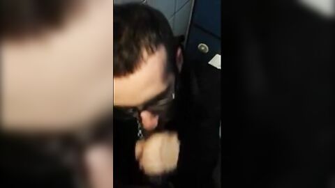 Bearded Guy Sucks Interracial Cock in a Public Restroom