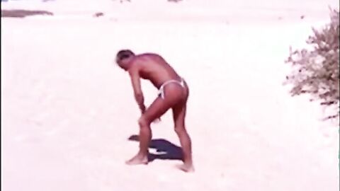 Beach Striptease: Tanned Hunk Bares All
