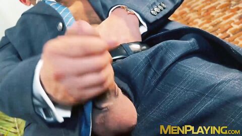 Suited Little Brako rubbed his while after stroking his long thick cock