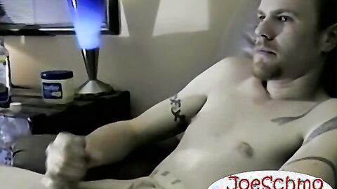 Handsome young model shoots hot cum on a towel