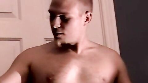 A white stud displays his big physique on the camera