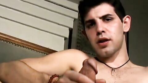 Slim twink tugs on his throbbing dick in this classic video