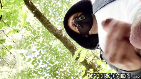 Masked guy Hans Berlin loves jerking off his big cock outdoors