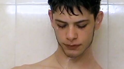 Sexy Bleu is blowing smoke and stroking his cock in the while taking a shower