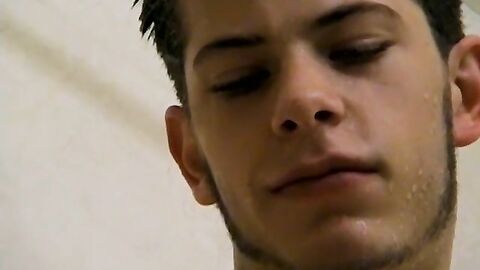 Sexy Bleu is blowing smoke and stroking his cock in the while taking a shower