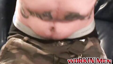 Seductive tattooed hunk jerks off while moaning in hot solo