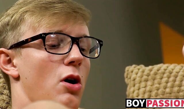 Twink with glasses bends over and shows off his tight butt