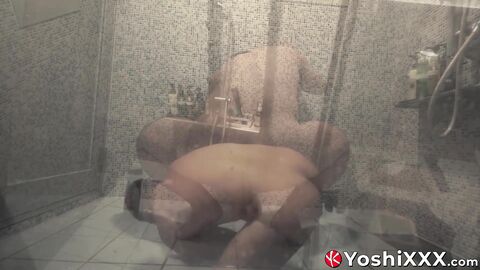 Hunky hairy Japanese lad Rio douches his hole in a glass shower with a massive dildo