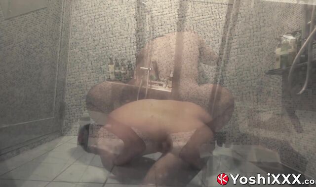 Hunky hairy Japanese lad Rio douches his hole in a glass shower with a massive dildo