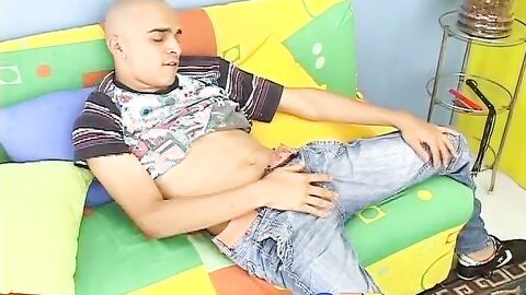 Kinky skinhead latino Cristobal is on the sofa wanking dick