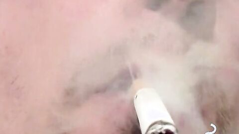 Tattooed skinny dude smoking and shooting cum on the floor