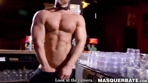 Buff stud strips nude to masturbate passionately behind bar