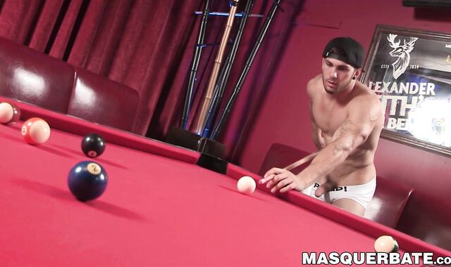 Attractive jock plays pool before stroking his big hard cock