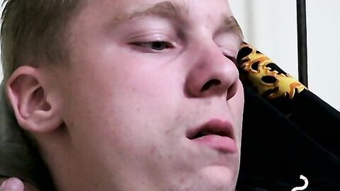 Twink savors the pleasure of smoking and stroking cock
