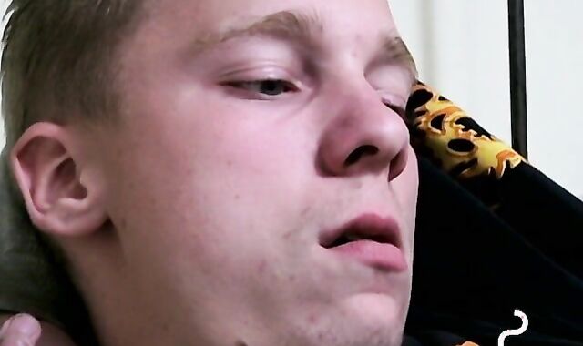 Twink savors the pleasure of smoking and stroking cock