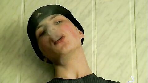 Smoking Twink caresses his cock in an exciting manner