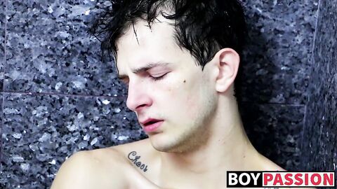 Tugging on his wet cock and moaning in the shower all alone