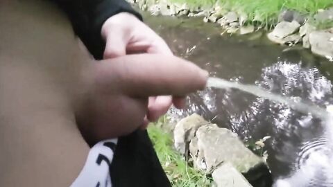 Pissing Outdoors with a Big Cock Twink