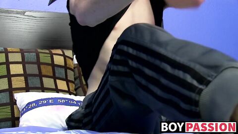 Cutie jerks off on the bed with a big dildo deep inside him