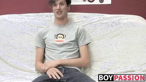 Adorable gay guy Danny jerks off his dick on couch solo