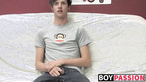 Adorable gay guy Danny jerks off his dick on couch solo