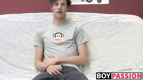 Adorable gay guy Danny jerks off his dick on couch solo