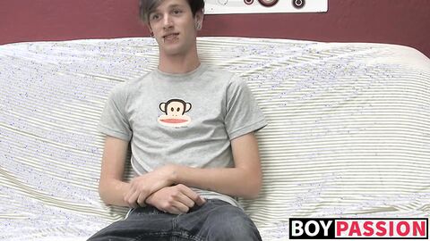 Adorable gay guy Danny jerks off his dick on couch solo