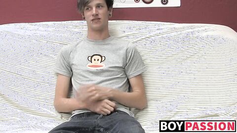Adorable gay guy Danny jerks off his dick on couch solo