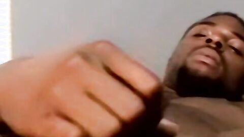 Amateur black guy jerks off solo with white dude kissing him
