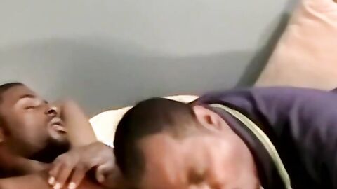 Amateur black guy jerks off solo with white dude kissing him